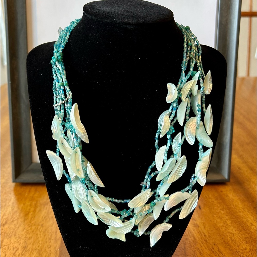 Seashell and beaded blue and white necklace.